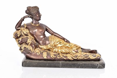 Lot 99 - A bronzed figure of a reclining Female