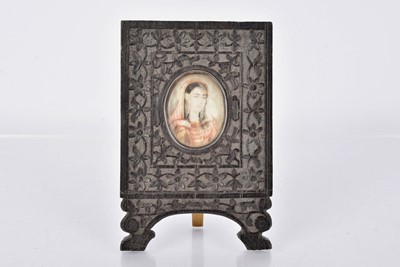 Lot 121 - An Antique Indian Miniature painting in carved wooden frame