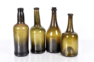 Lot 128 - A group of four early 19th Century Green Glass Bottles
