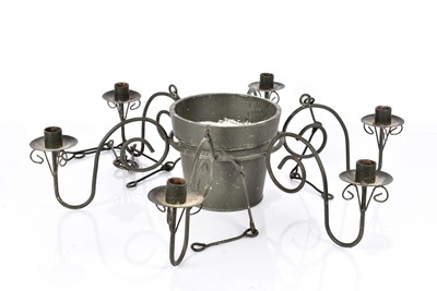 Lot 179 - A wrought iron candelabra