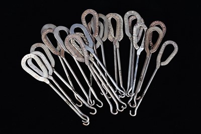 Lot 436 - A collection of steel advertising button hooks