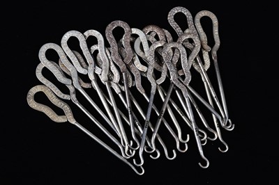 Lot 438 - A collection of steel advertising button hooks