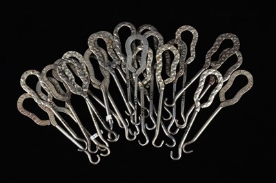Lot 440 - A collection of steel advertising button hooks