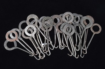 Lot 442 - A collection of steel advertising button hooks