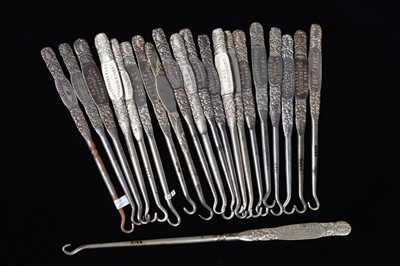 Lot 443 - A collection of steel advertising button hooks