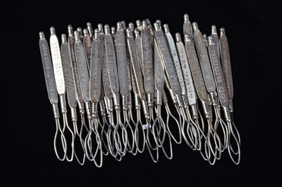 Lot 446 - A collection of steel advertising button loops