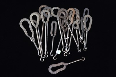 Lot 452 - A collection of steel advertising  button hooks
