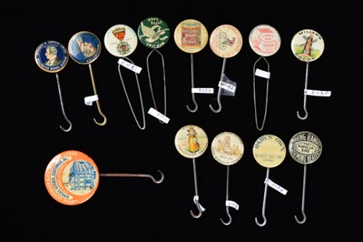 Lot 454 - A collection of late 19th and early 20th Century advertising button hooks and loops