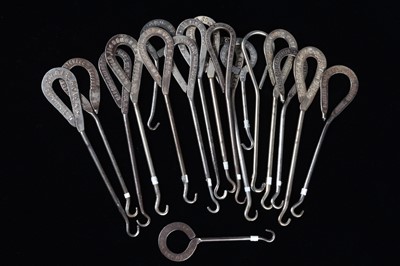 Lot 455 - A collection of steel advertising button hooks