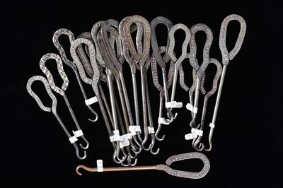 Lot 456 - A collection of steel advertising button hooks