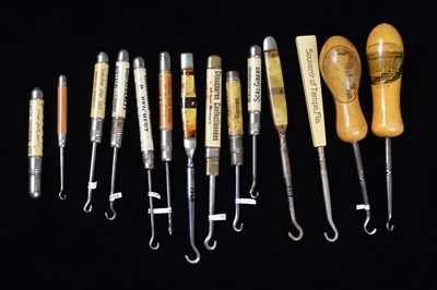 Lot 461 - Plastic and treen handled advertising button hooks