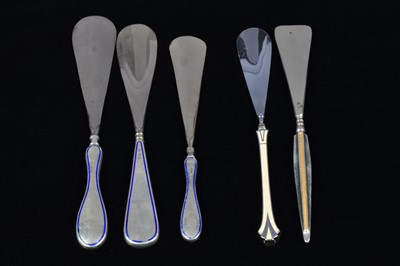 Lot 472 - Four silver handled shoehorns