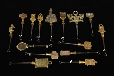 Lot 473 - A collection of steel brass handle mounted souvenir and commemorative button hooks