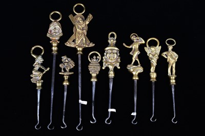 Lot 477 - A collection of steel brass handle mounted souvenir and commemorative button hooks