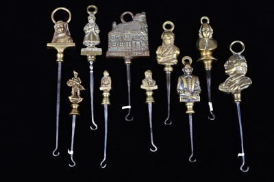 Lot 478 - A collection of steel brass handle mounted souvenir and commemorative button hooks