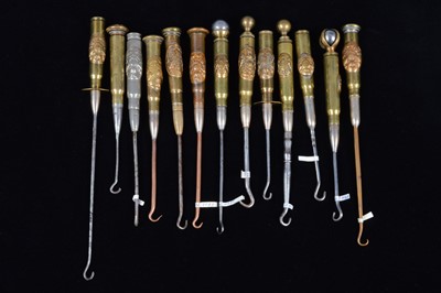 Lot 484 - A collection of thirteen trench art Royal Engineers 'Honi soit qui mal y pense' cypher mounted converted shell button hooks