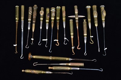 Lot 485 - A collection of trench art converted shell button hooks