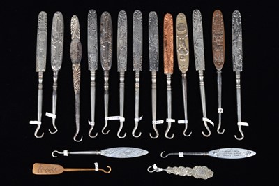 Lot 488 - A collection of 19th Century steel and brass flattened souvenir button hooks