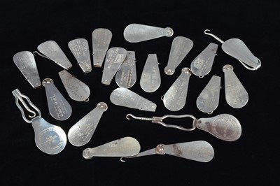 Lot 495 - A collection of advertising steel combination button hook and shoehorns