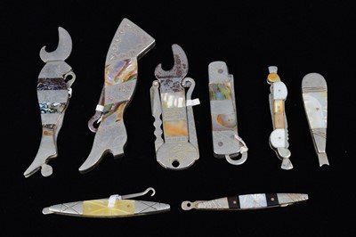 Lot 497 - A collection of abalone and mother of pearl handled retractable handbag or pocket button hooks