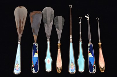 Lot 499 - Four sets of matching enamel handled shoehorn and button hooks