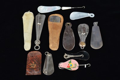Lot 505 - Eleven combination shoehorn and button hooks