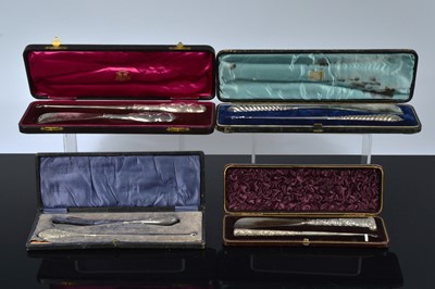 Lot 512 - Four cased silver handled button hook and shoehorn sets
