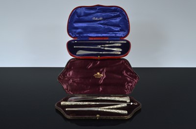Lot 515 - Two cased three piece silver sets