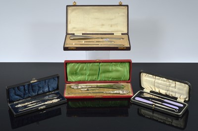 Lot 517 - Four cased three piece dressing table sets