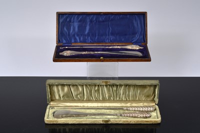Lot 518 - Two cased silver handled button hook and shoehorn sets