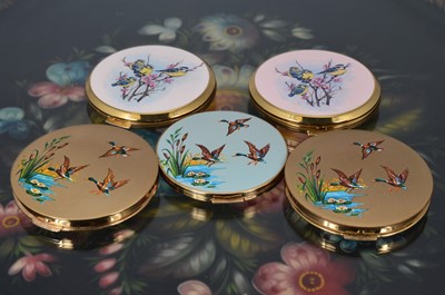 Lot 522 - Five gilt metal and coloured enamel decorated 1970s circular Stratton powder compacts