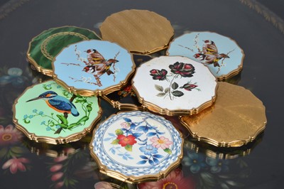 Lot 523 - Nine scalloped edged circular 1950s and later gilt metal and coloured enamel decorated convertible Stratton compacts