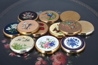 Lot 529 - Twelve gilt metal, chromed and coloured enamel decorated 1970s circular Stratton powder compacts