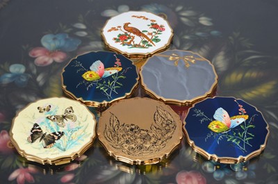 Lot 532 - Six scalloped edged circular 1950s and later gilt metal and coloured enamel decorated Stratton compacts