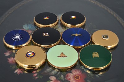 Lot 533 - Nine 1960s and later circular gilt metal and coloured enamel decorated commemorative Stratton compacts