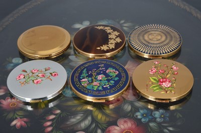 Lot 534 - Six 1960s circular gilt metal, chromed and coloured enamel decorated Stratton compacts