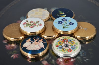 Lot 537 - Nine 1960s circular gilt metal, chromed and coloured enamel decorated 'Convertible' Stratton compacts