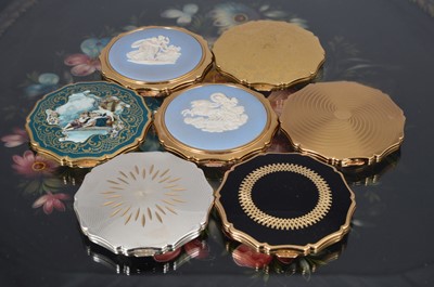 Lot 538 - Seven 1960s and later scalloped edged circular gilt metal, chromed and coloured enamel Stratton compacts