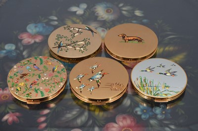 Lot 543 - Five 1960s circular gilt metal and coloured enamel decorated Stratton compacts
