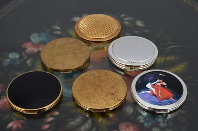 Lot 546 - Six 1960s and later circular gilt metal and chromed coloured enamel decorated Stratton compacts