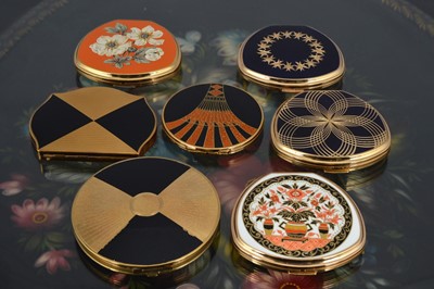 Lot 552 - Seven gilt metal and chromed coloured enamel decorated 1950s and later Stratton compacts