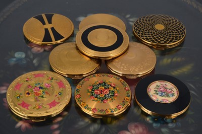 Lot 554 - A collection of nine 1950s and later Kigu gilt metal circular compacts
