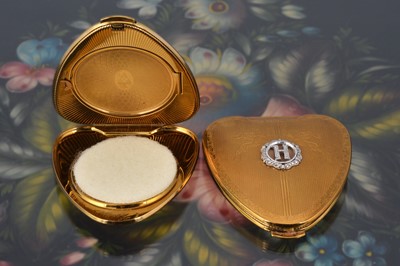 Lot 562 - Two 1950s Kigu gilt metal Cherie heart shaped compacts
