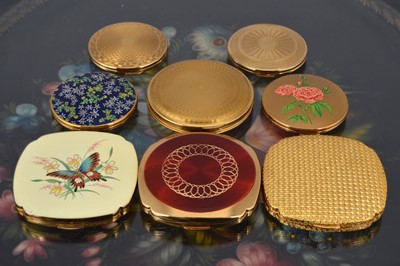 Lot 564 - A collection of four circular 1950s gilt metal Kigu compacts