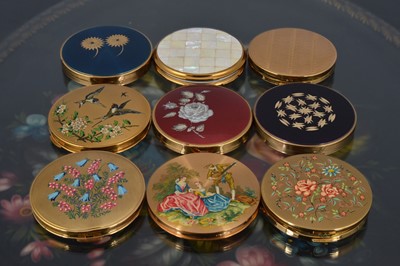 Lot 567 - Nine 1950s and later British Made circular gilt metal compacts
