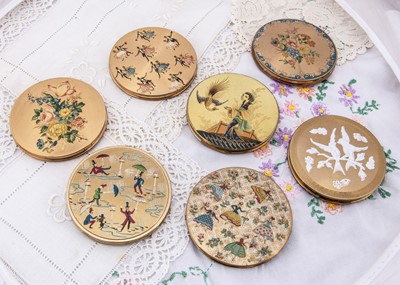 Lot 578 - Seven circular gilt metal powder compacts