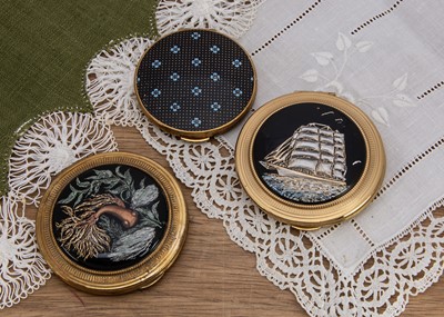 Lot 585 - Three Kigu circular compacts