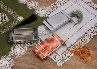 Lot 587 - Three rectangular Art Deco Japanese cigarette, powder, lipstick compacts