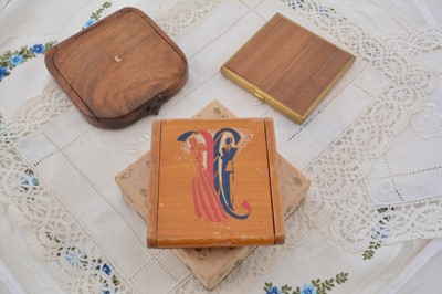 Lot 604 - Three square wooden or wooden veneered compacts