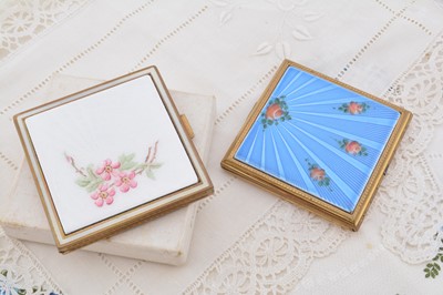 Lot 607 - Two 1950s square enamelled gilt metal Evans compacts